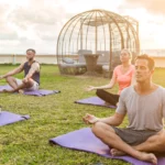 4 people doing meditation in ground