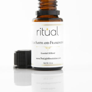 bottle of ritual brand palo santo and frankincense essential oil by the light revolution