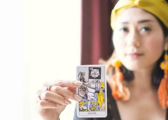 woman holding goddess card